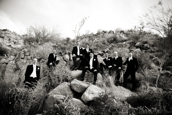 black and white photo of groom and groomsmen posing for group portrait on rocky cliff in the countryside - wedding photo by Jennifer Bowen Photography